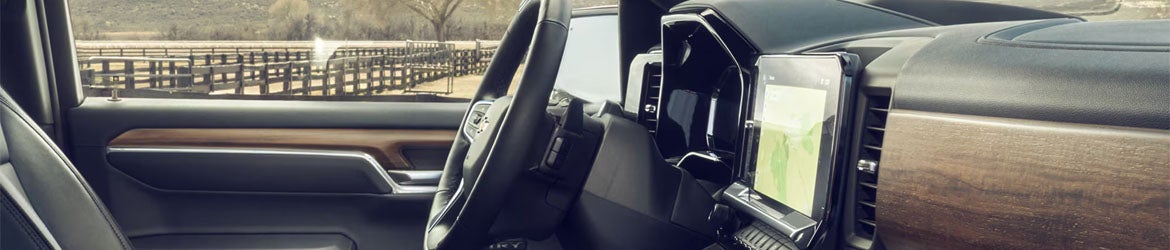 Close-up of the steering wheel in the 2026 Chevrolet Silverado 1500 in Eureka, IL, showcasing the premium materials and advanced controls for enhanced driving comfort and convenience.