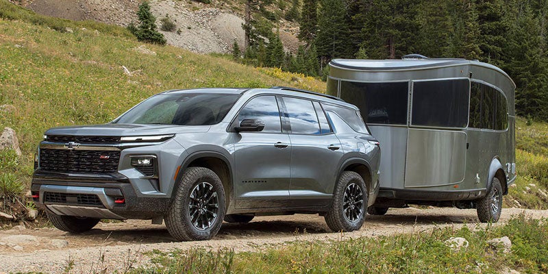 2026 Chevrolet Traverse towing a trailer near Eureka IL showcasing 5000 lb towing capacity and 2.5L Turbocharged engine
