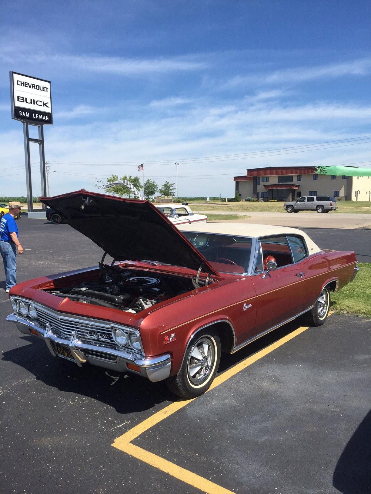 red car with bonnet open